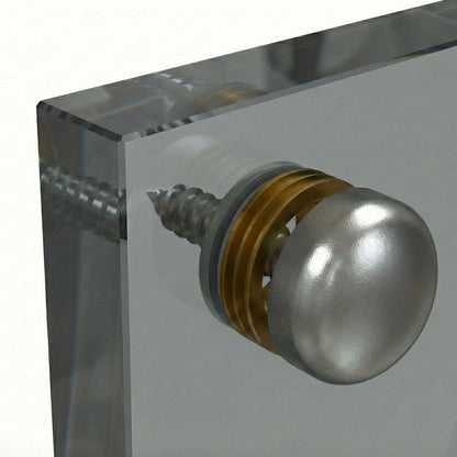 Metallic knob on a clear acrylic block with glass backsplash
