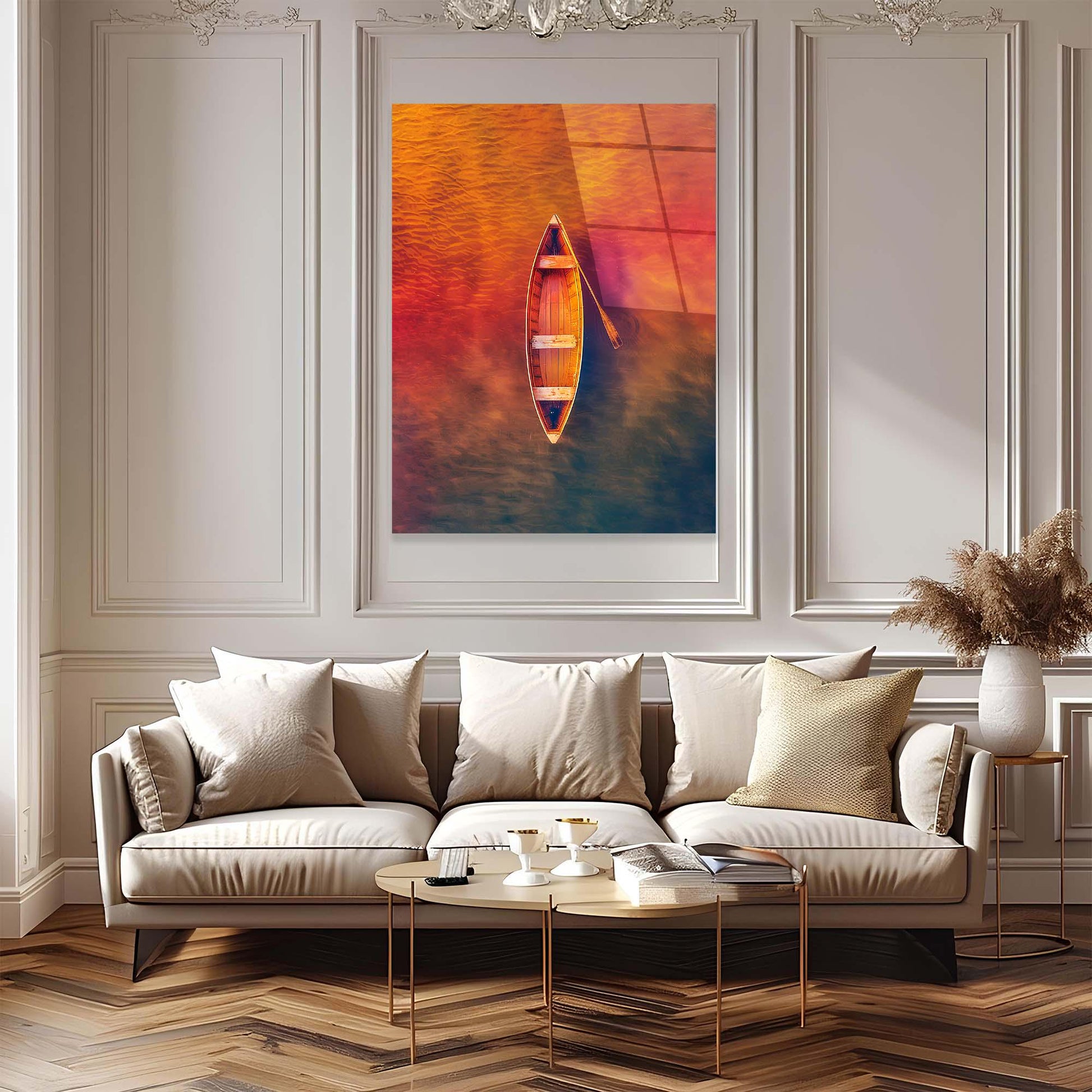 Modern living room with a sofa, coffee table, and framed artwork of a boat on water.