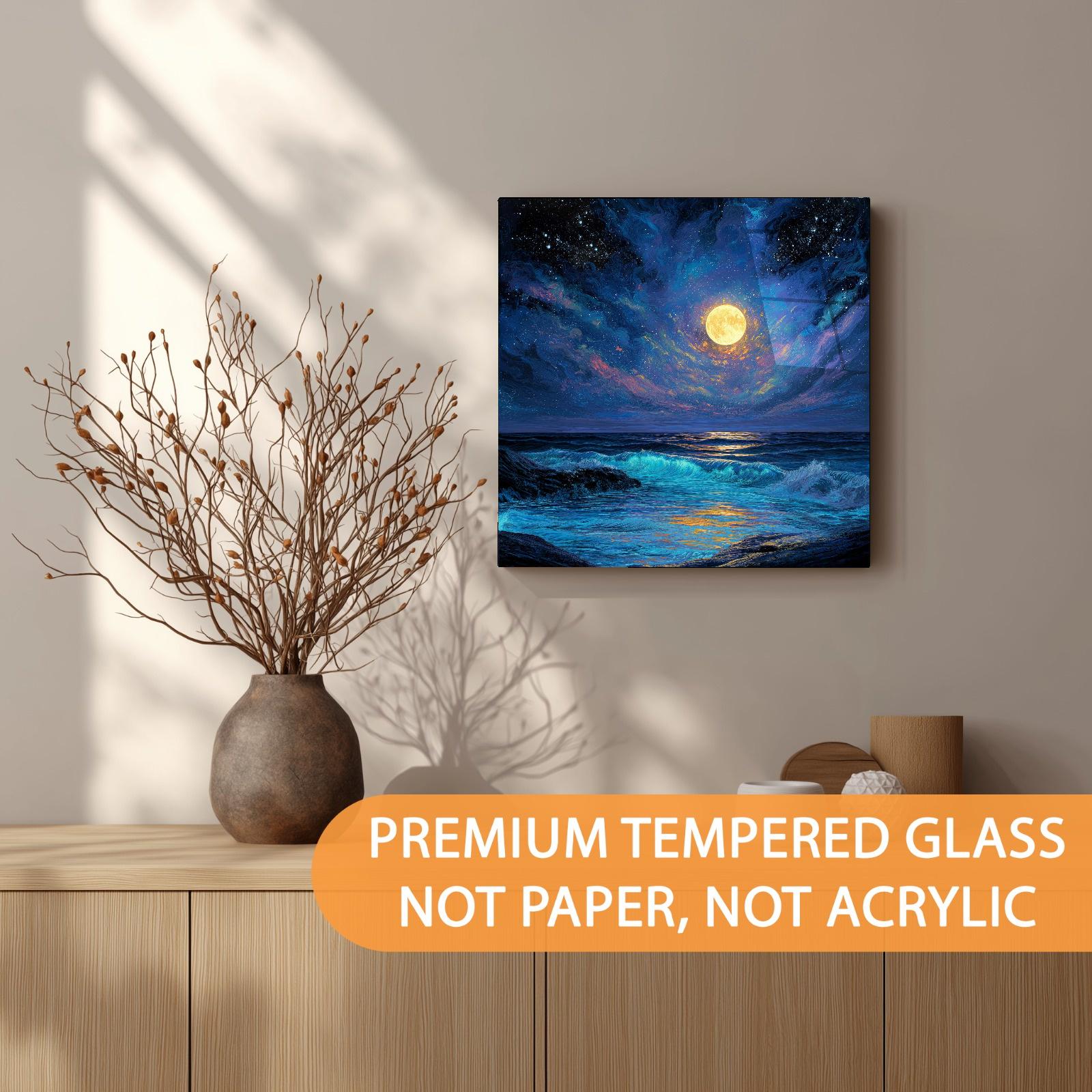 Canvas print of a moonlit ocean scene on a wall above a wooden shelf with decorative items.