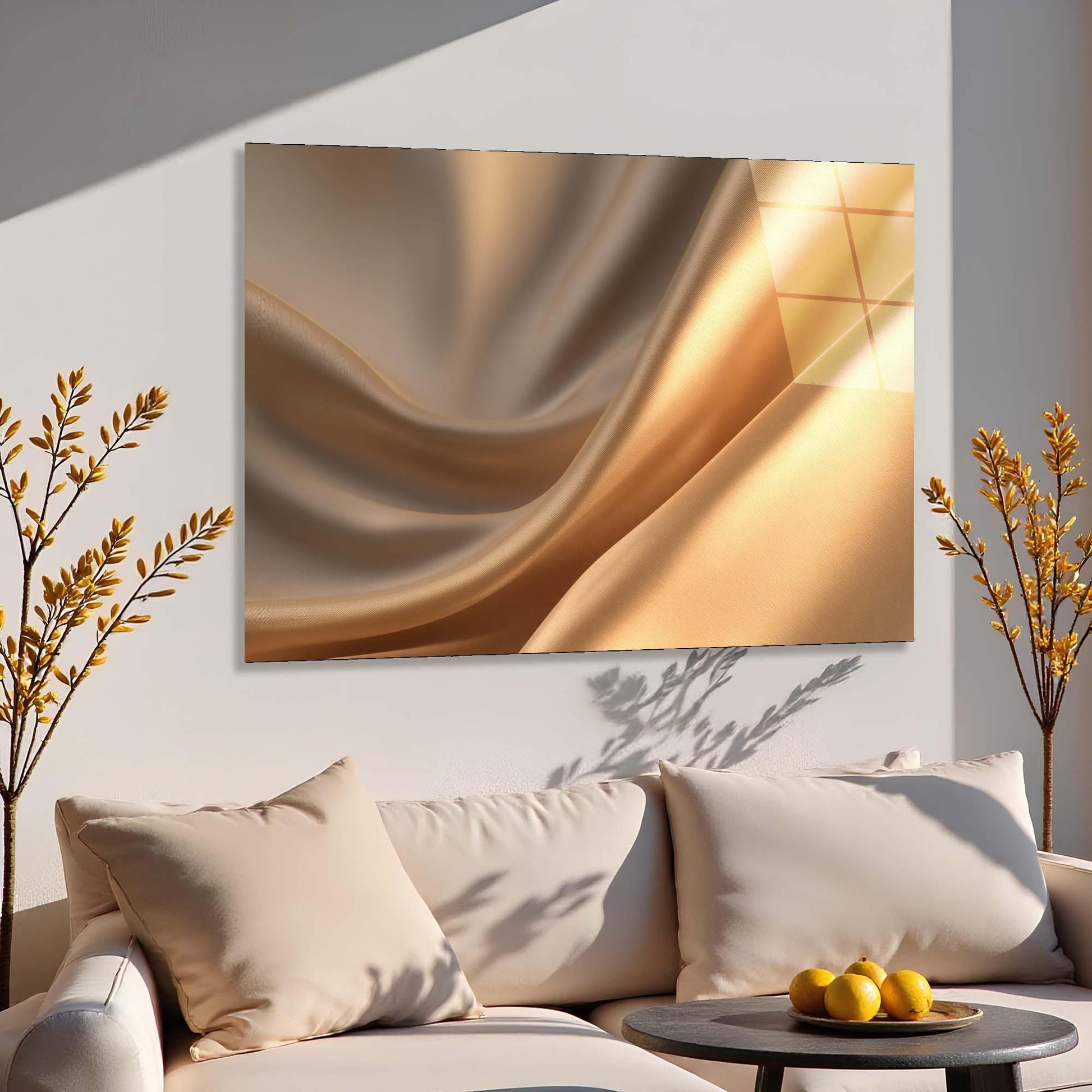 Abstract gold painting on a wall above a beige sofa with decorative pillows.