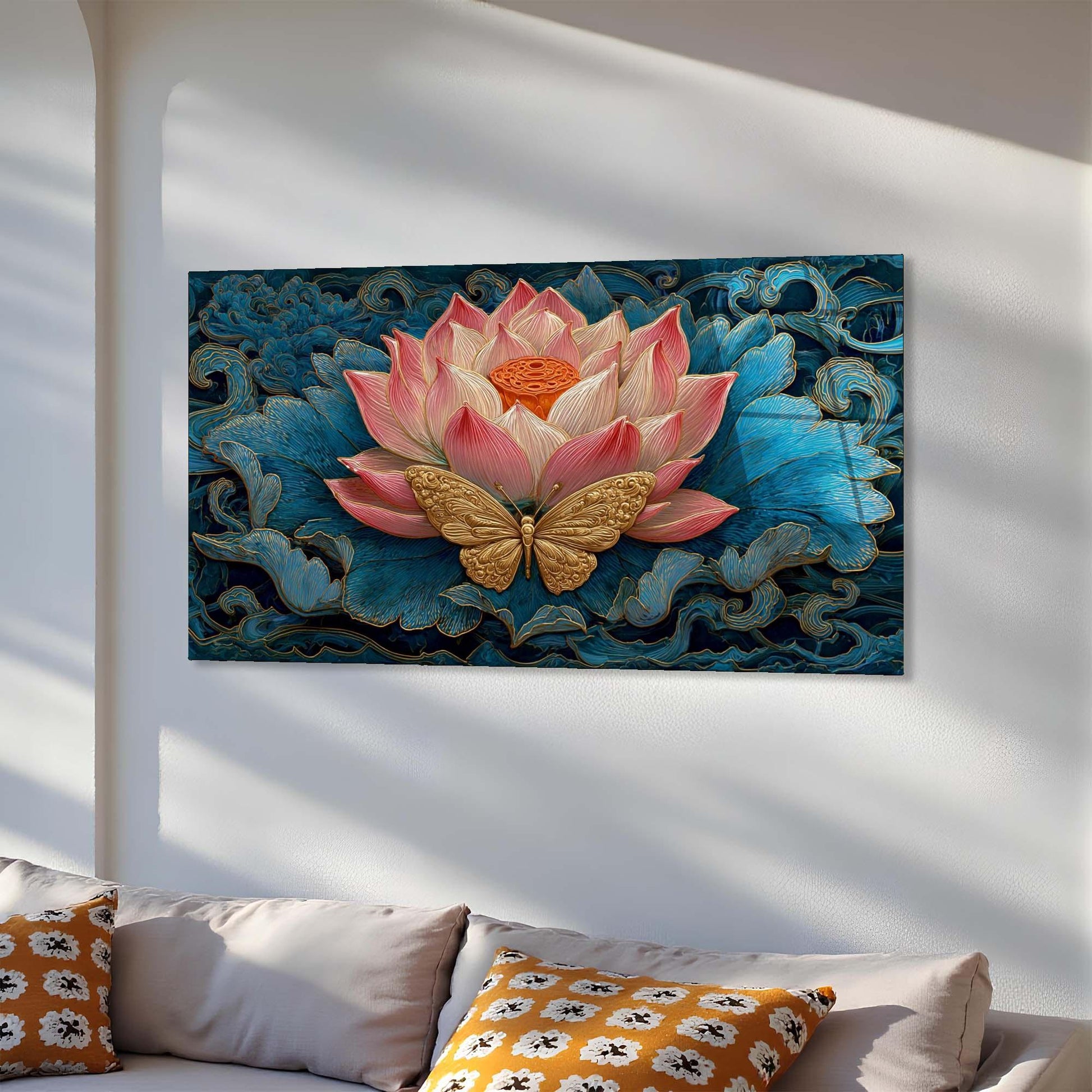 Decorative wall art with a pink lotus flower and gold butterfly on a blue background, displayed above a sofa.