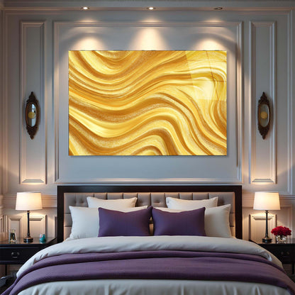 Gold abstract painting above a bed in a bedroom setting