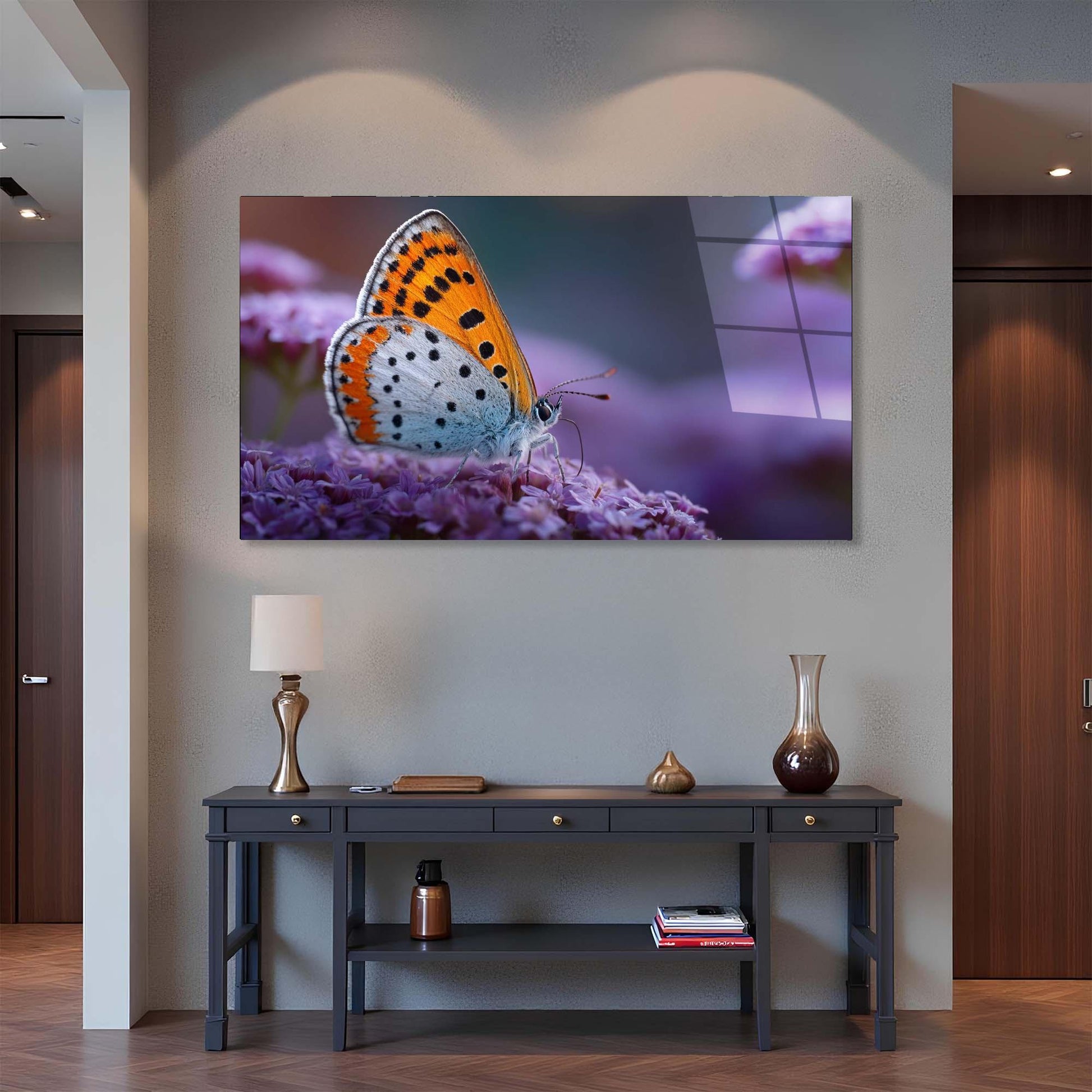 Butterfly on a flower painting above a console table in a room.