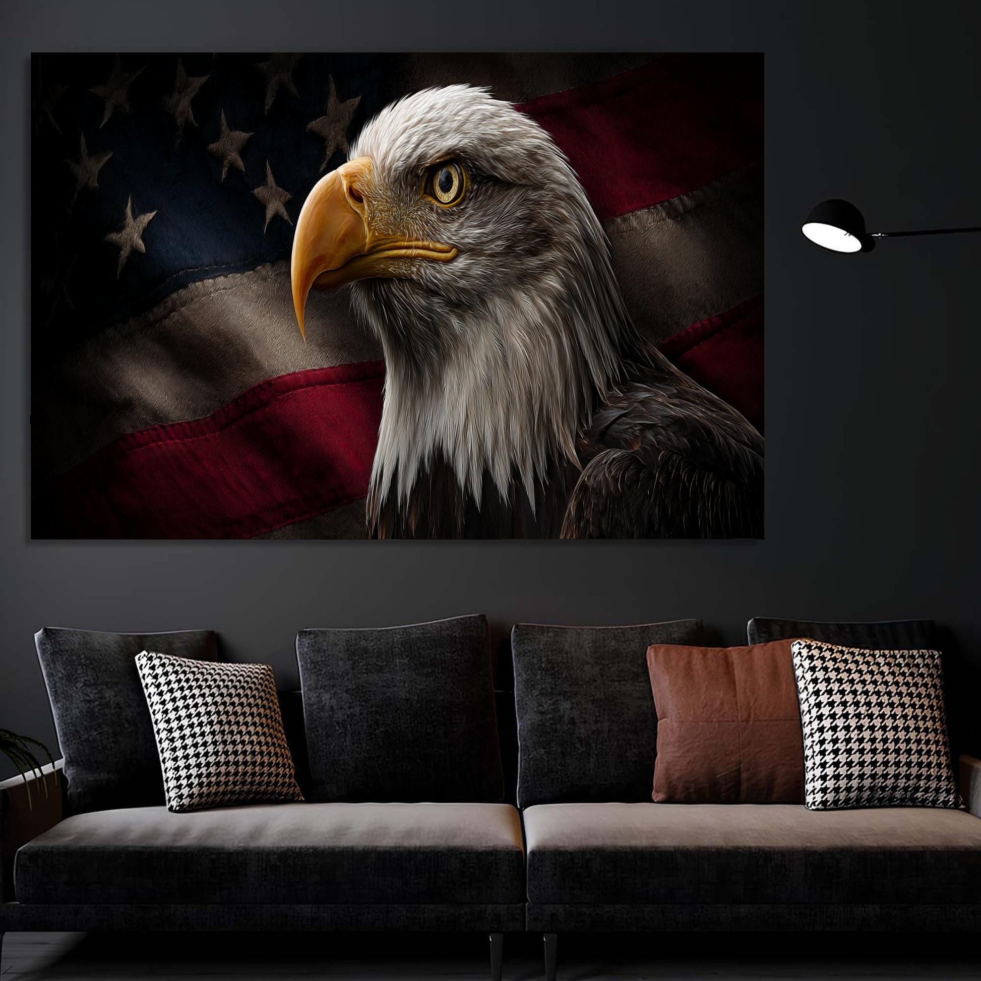 Eagle painting on a wall above a gray sofa with patterned cushions.