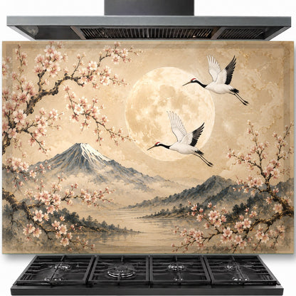 Moon Cranes tempered glass backsplash installed behind a modern gas stove in a minimalist kitchen.