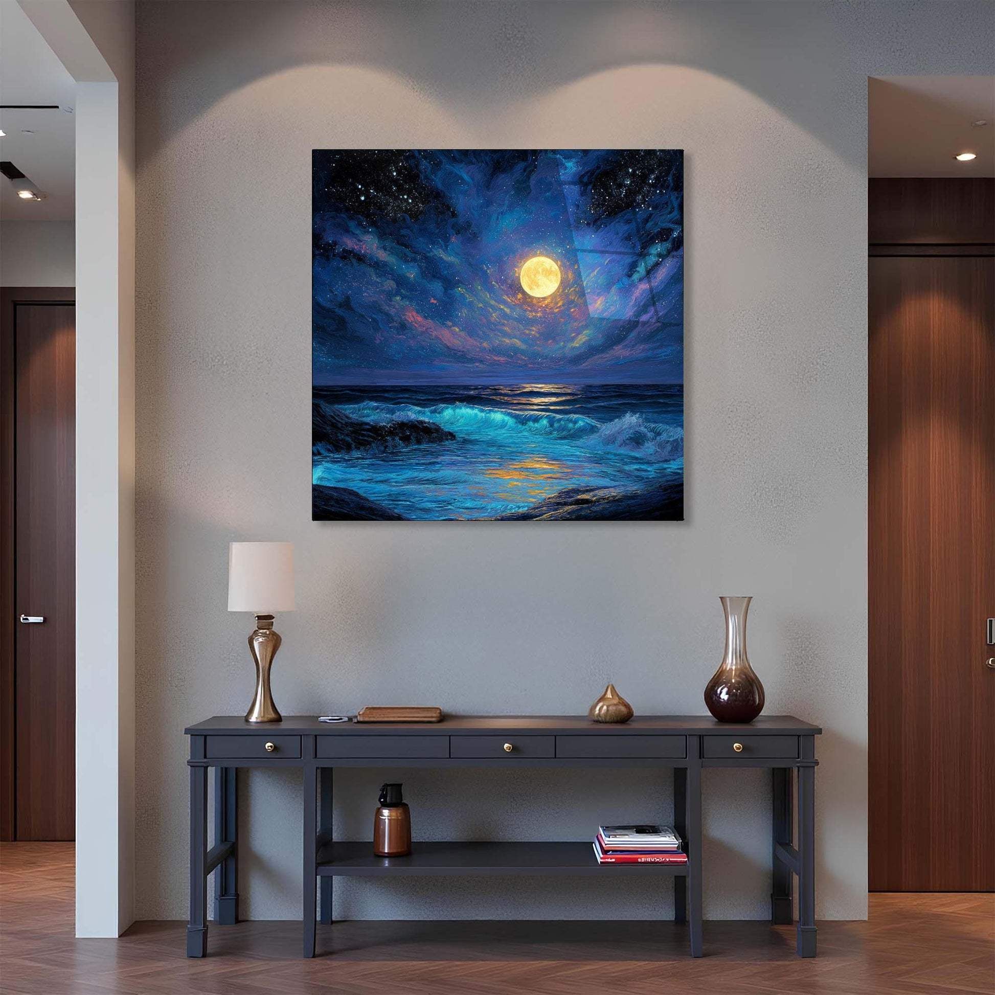 Framed artwork of a moonlit ocean scene above a console table in a room.
