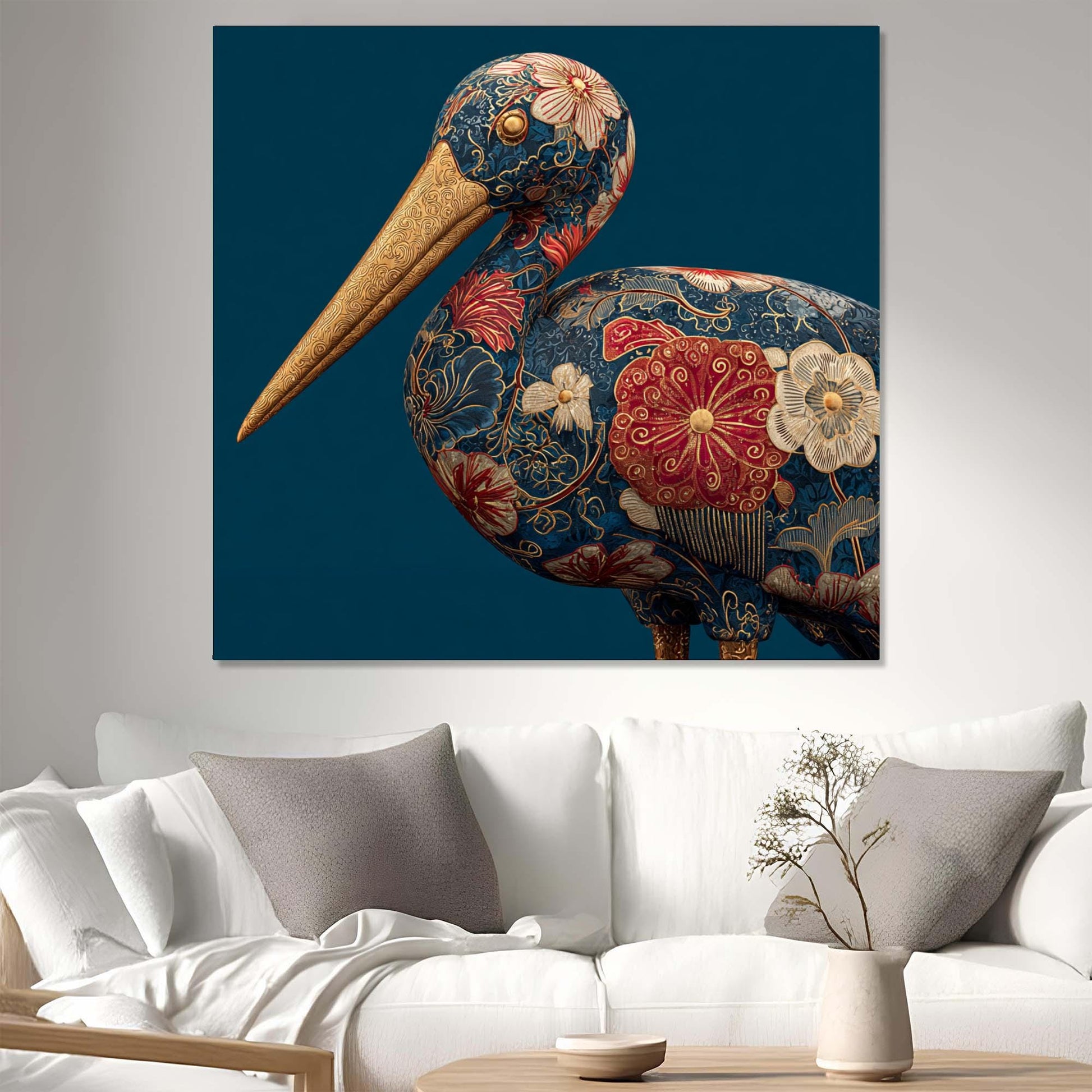 Decorative pelican painting with floral patterns on a blue background, hanging above a white sofa.