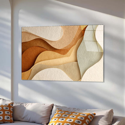 Abstract wall art with wavy patterns in earthy tones on a white wall.