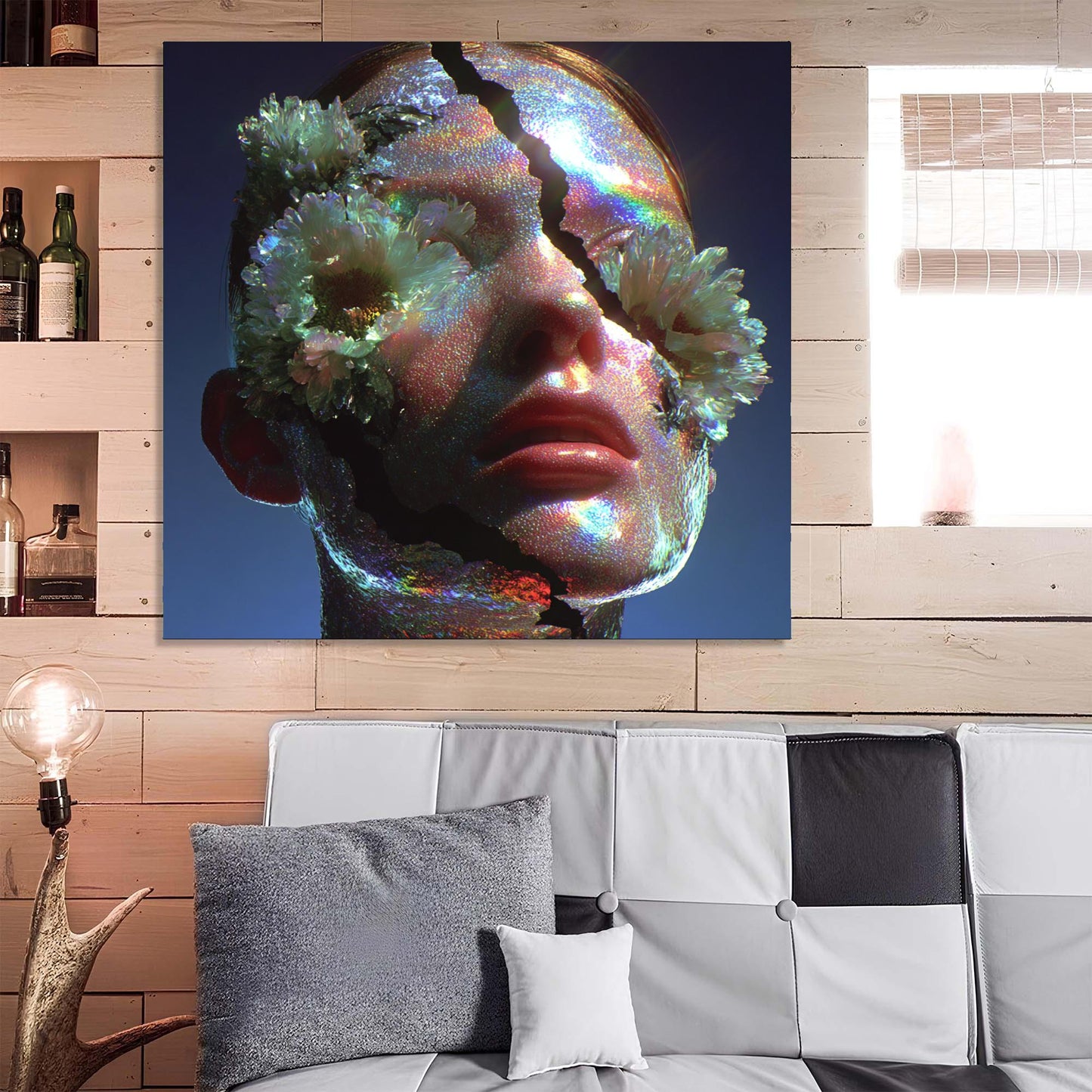 Abstract art piece of a face with flowers on a blue background, displayed above a sofa.