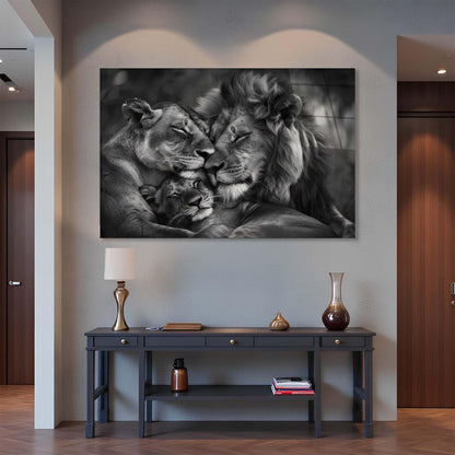 Framed black and white artwork of a lion and lioness on a wall above a console table.
