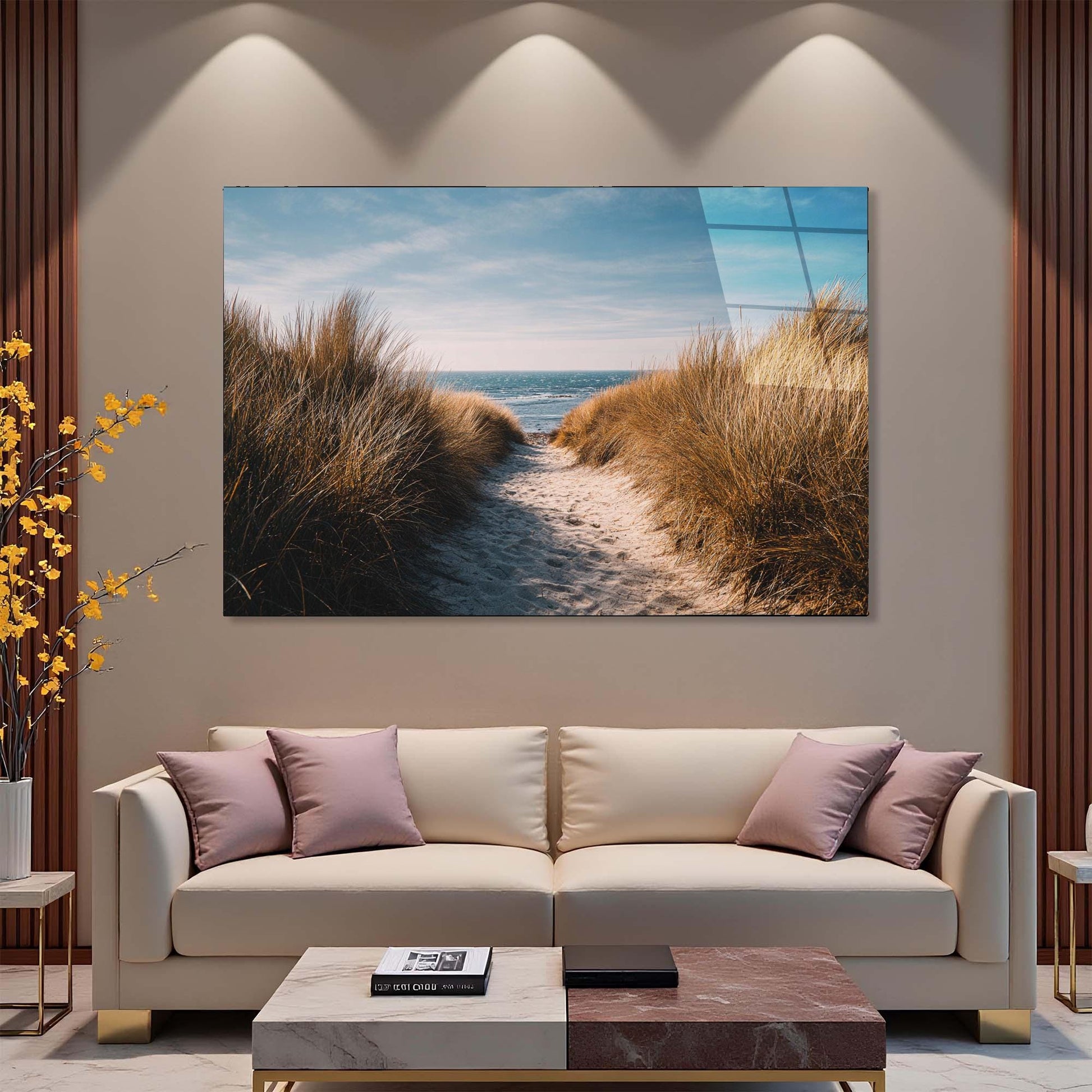 Modern living room with a large TV displaying a beach scene, beige sofa, and decorative elements.