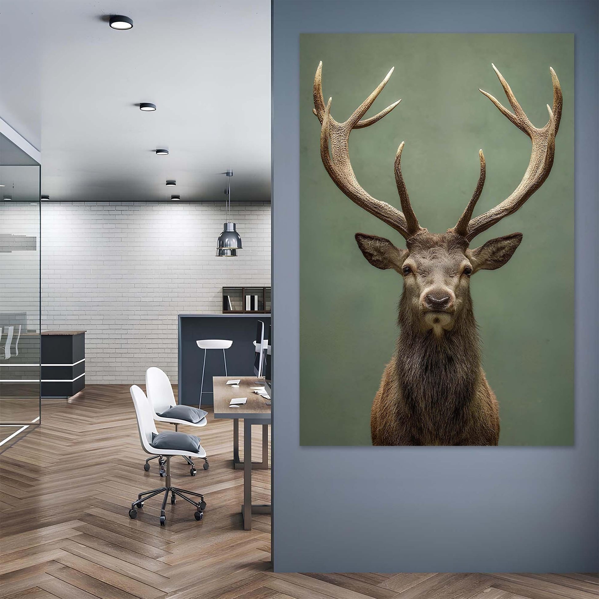 Modern office interior with a large deer head painting on the wall.