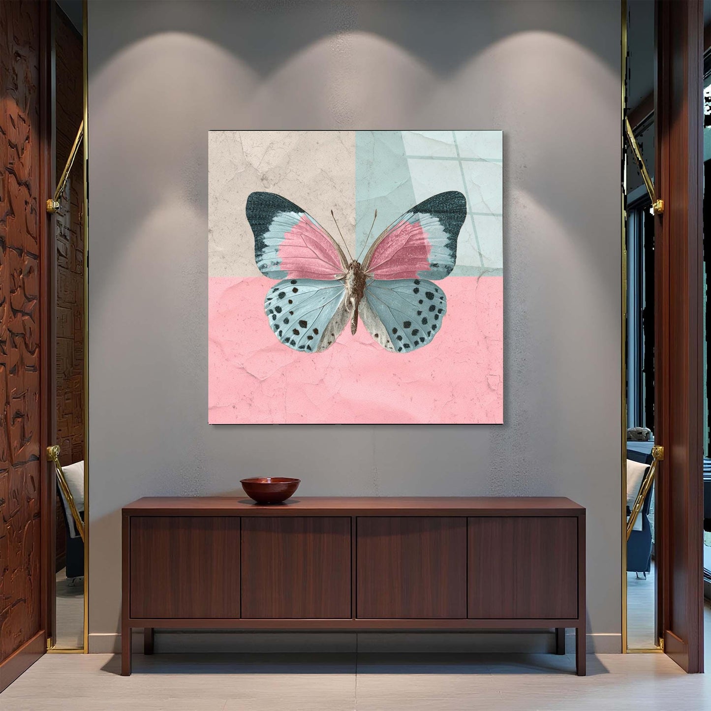 Butterfly artwork on a wall above a wooden cabinet