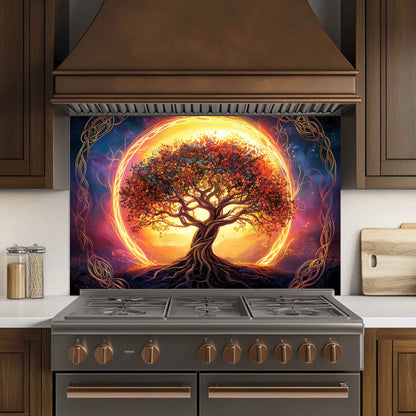 Stainless steel stove with a decorative glass panel featuring a tree of life design in a kitchen setting.