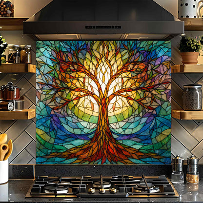 Colorful stained glass tree design on a kitchen backsplash above a stove.