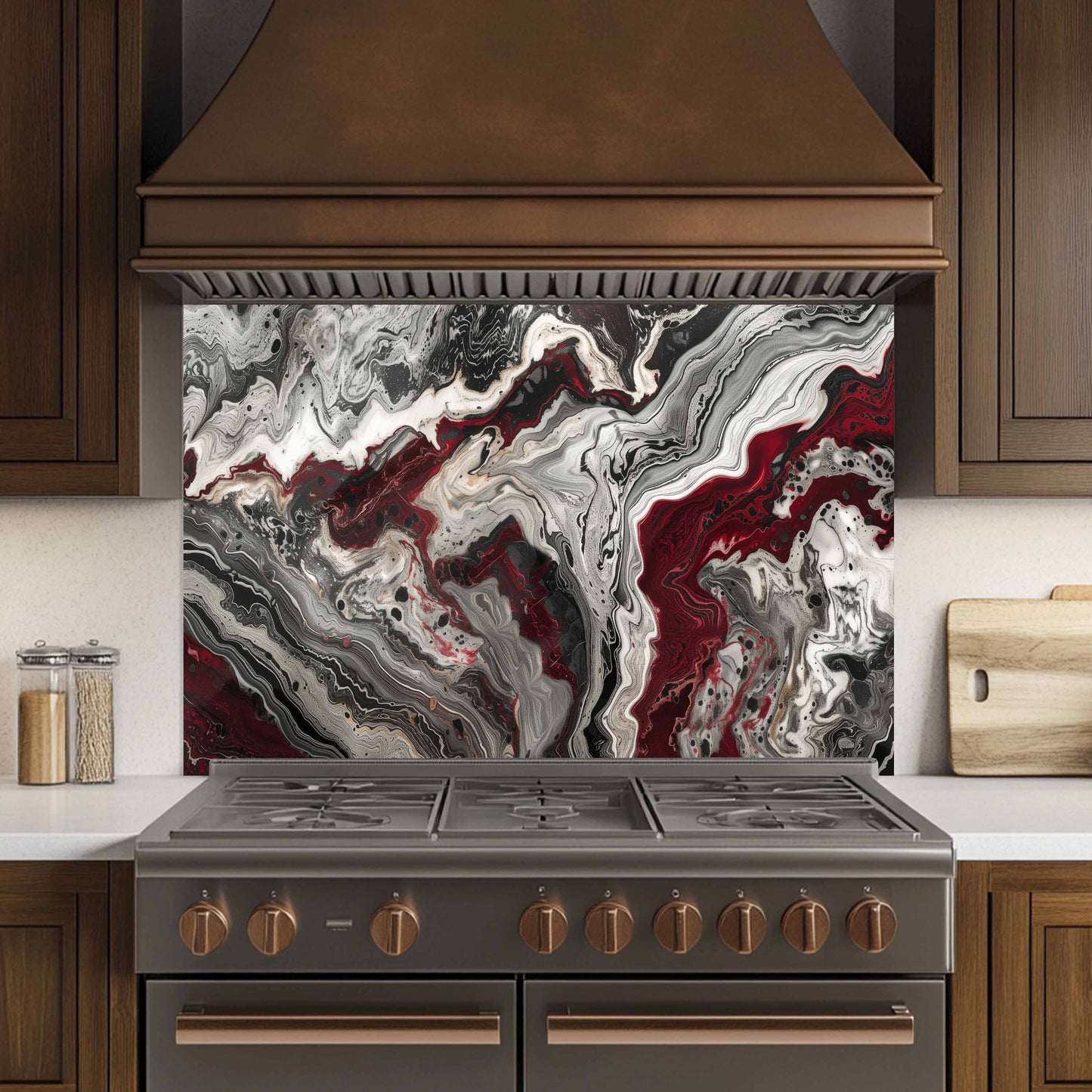 Stainless steel stove with marbled backsplash in a kitchen setting