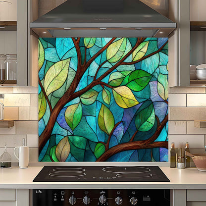 Colorful stained glass-style leaf design on a kitchen backsplash.