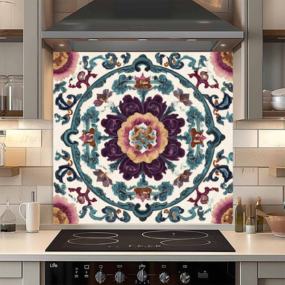 Decorative glass backsplash with floral pattern above a stove in a kitchen.