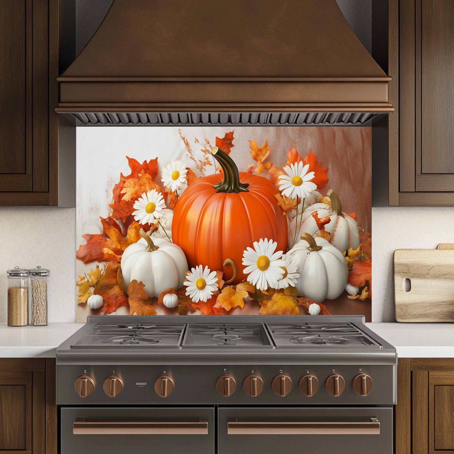 Decorative backsplash with pumpkins, leaves, and flowers above a stove in a kitchen.