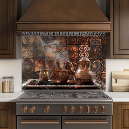 Kitchen stove with copper pots and a decorative glass backsplash.