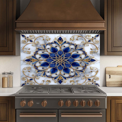 Decorative glass backsplash with blue and gold pattern above a stove in a kitchen.