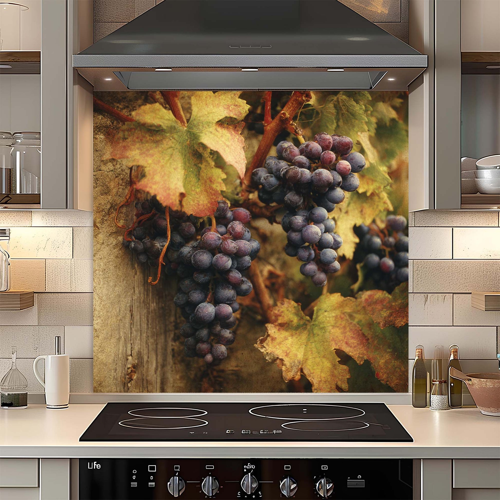 Kitchen with a decorative glass backsplash featuring grapes and leaves