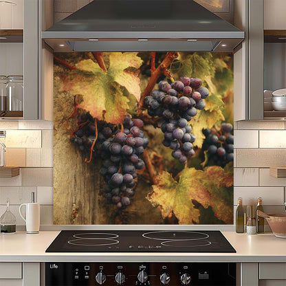 Kitchen with a decorative glass backsplash featuring grapes and leaves