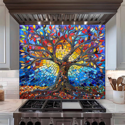 Colorful mosaic tree design on a kitchen backsplash above a stove.