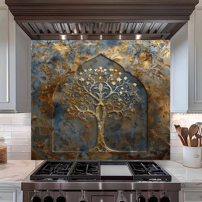 Decorative backsplash with tree design above a stove in a kitchen.