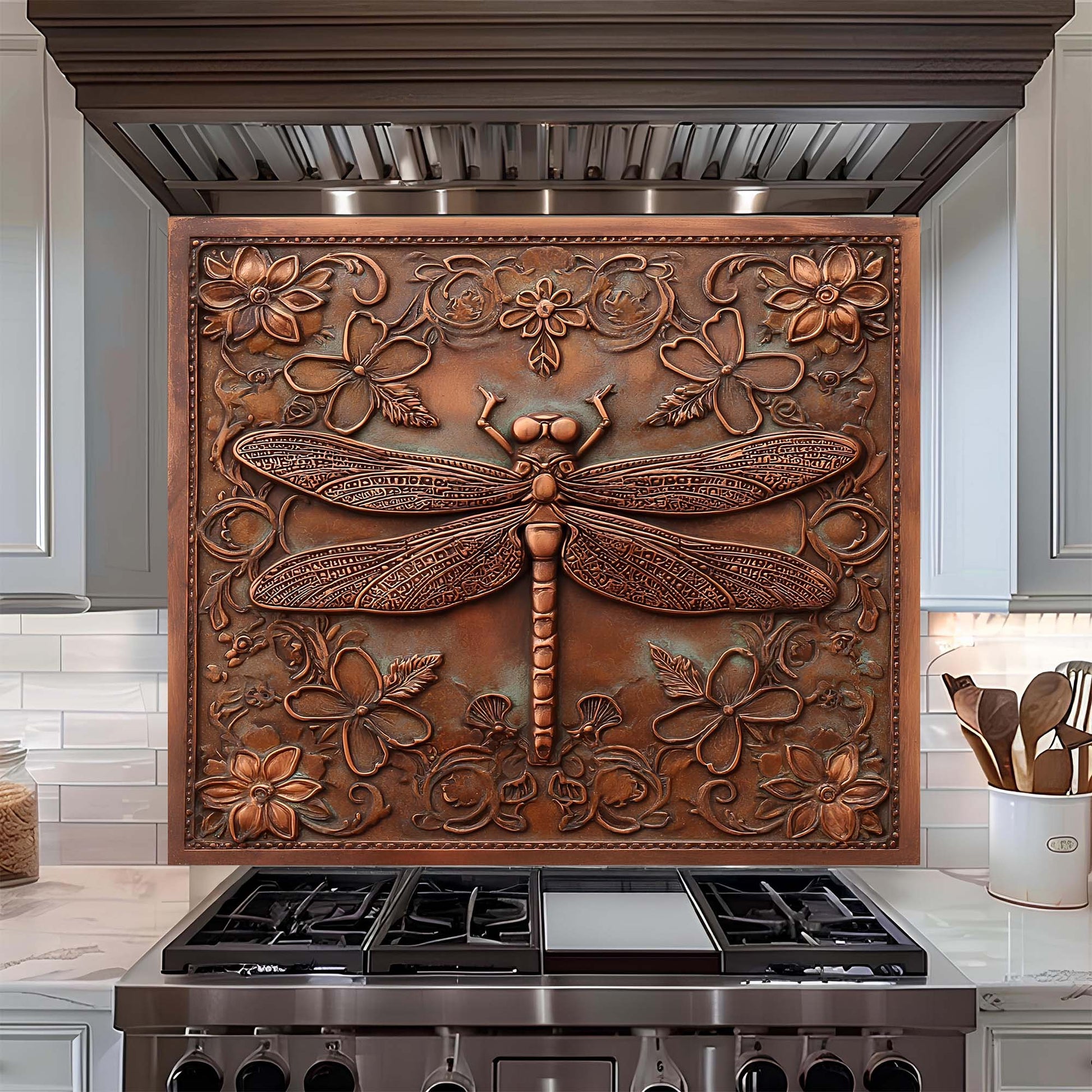 Decorative copper look glass backsplash with floral and dragonfly design above a stove.