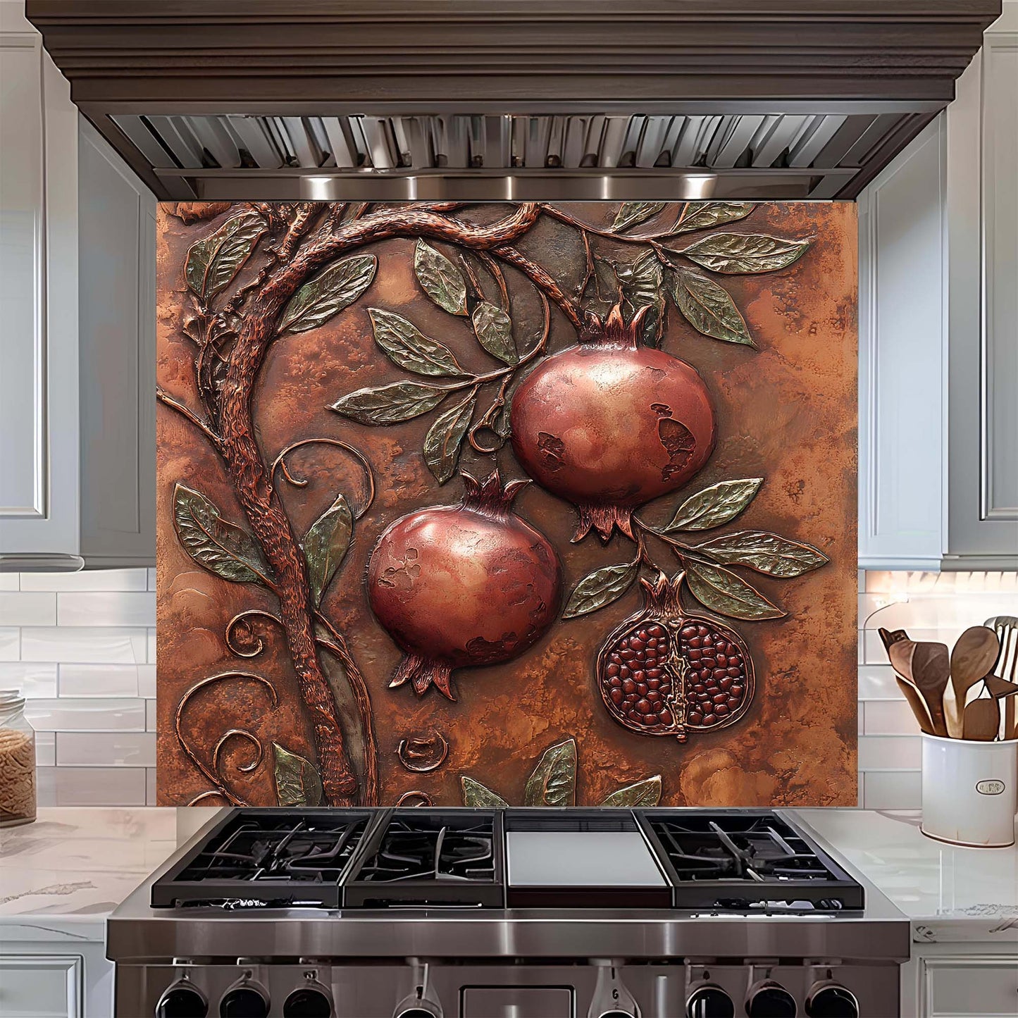 Decorative backsplash with pomegranate design above a stove in a kitchen.