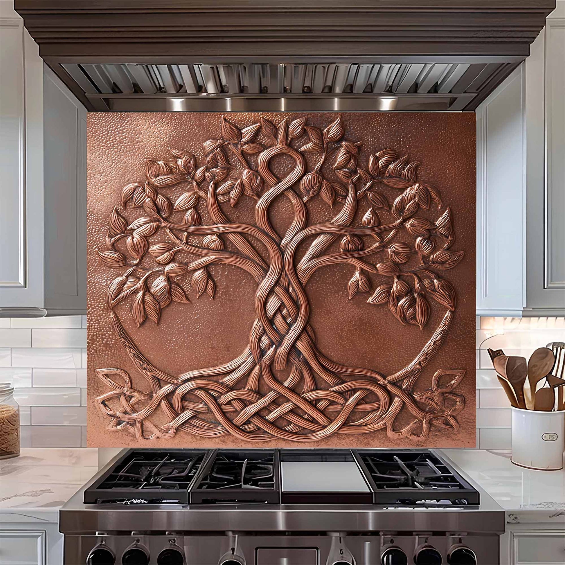 Decorative copper tree backsplash above a stove in a kitchen setting