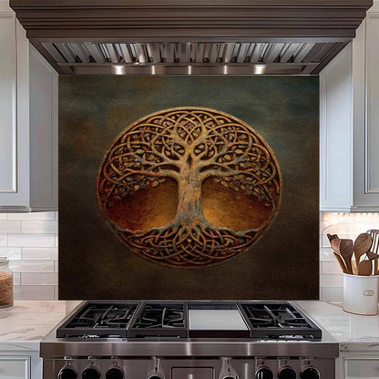 Decorative backsplash with tree of life design above a stove in a kitchen.
