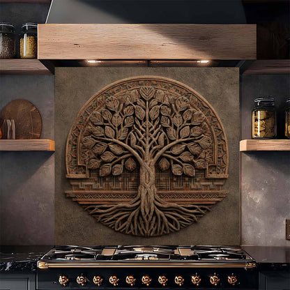 Decorative glass backsplash of a tree on a kitchen wall above a stove.