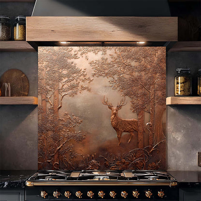 Decorative copper look glass backsplash with a deer design above a stove in a kitchen.