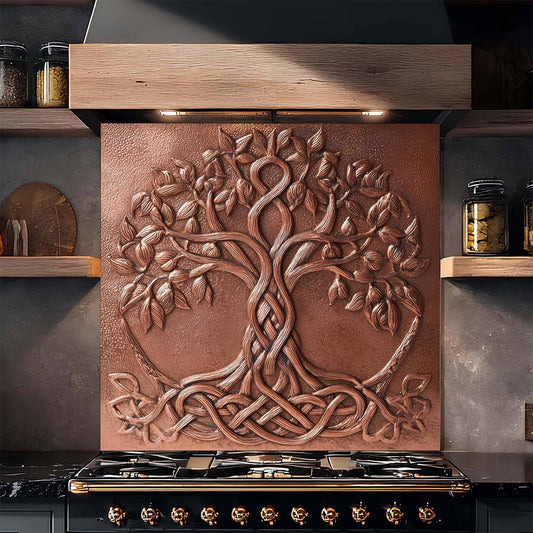 Decorative glass backsplash with tree design above a stove in a kitchen.