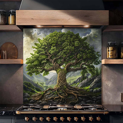 Decorative tempered glass backsplash of a tree with intricate roots on a kitchen wall above a stove.