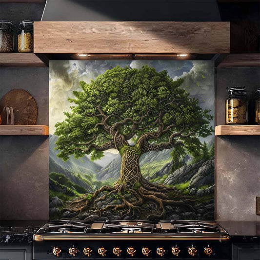Decorative tempered glass backsplash of a tree with intricate roots on a kitchen wall above a stove.