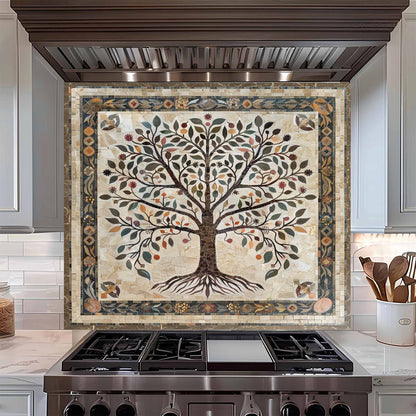 Decorative backsplash with a tree design above a stove in a kitchen.