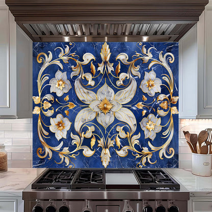 Decorative floral backsplash with gold and white flowers on a blue background above a stove.