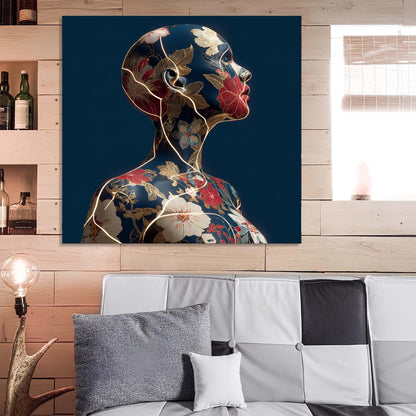 Abstract art of a woman's profile with floral elements on a blue background, displayed above a sofa.