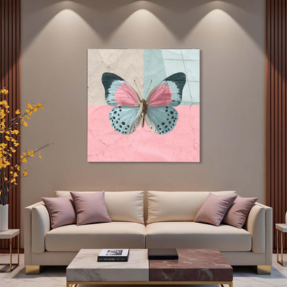 Butterfly artwork on a wall above a beige sofa in a living room setting.