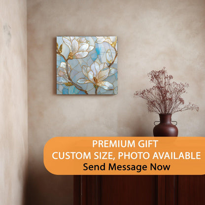 Decorative wall art with floral design on a beige wall, accompanied by a vase with dried flowers.