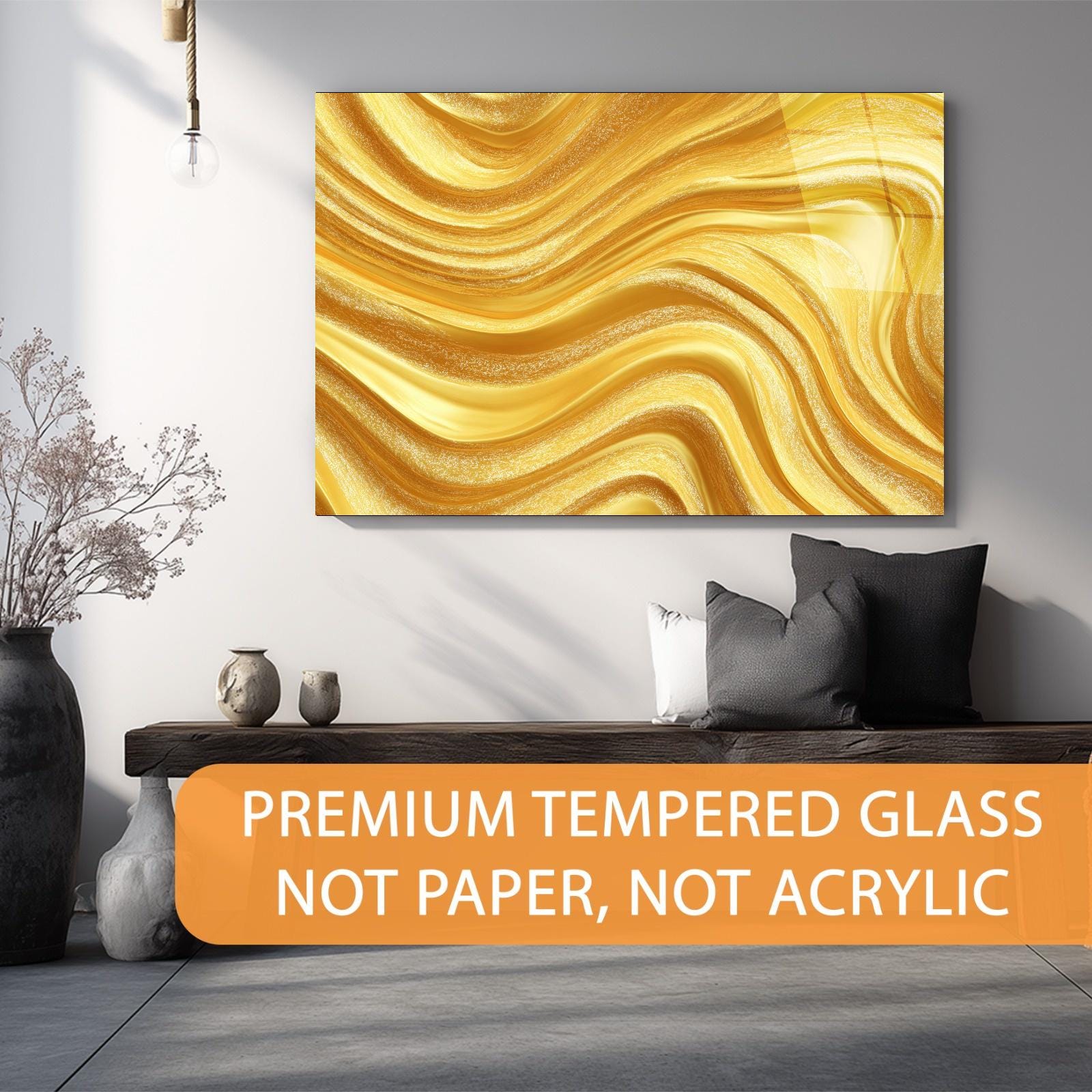 Gold abstract wall art in a modern living room setting with text about premium tempered glass.