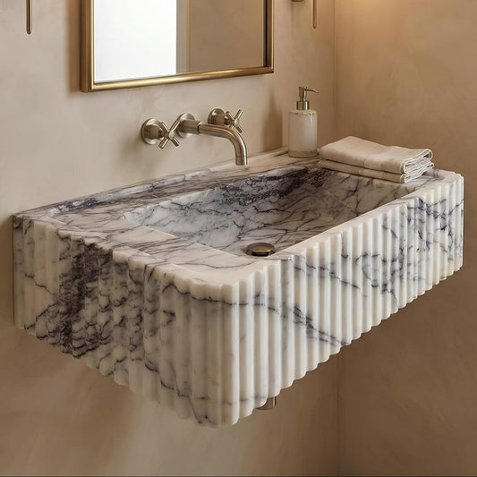 Marble sink with faucet in a bathroom setting