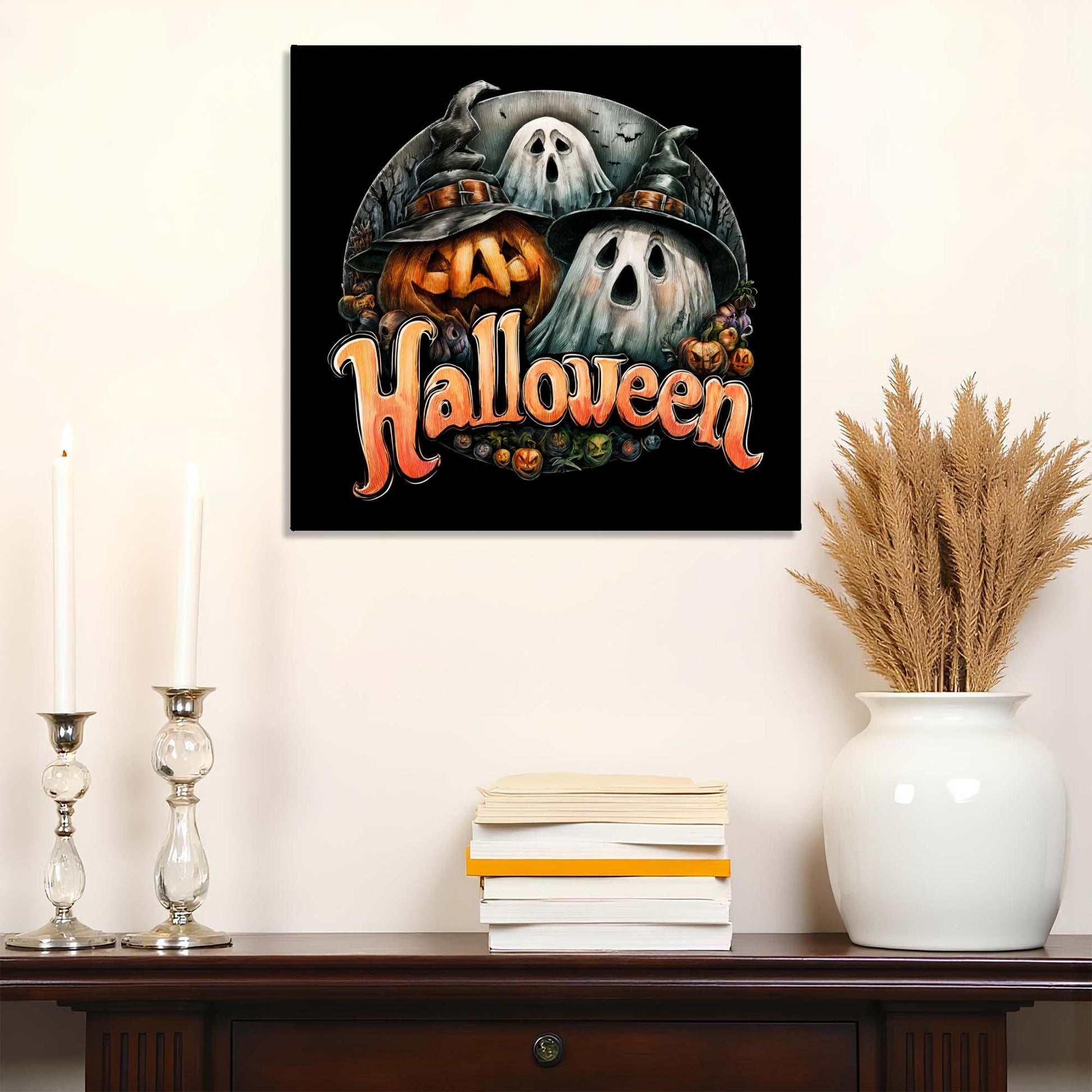 Halloween-themed wall art with pumpkins and ghosts on a black background, displayed on a wall above a wooden shelf.