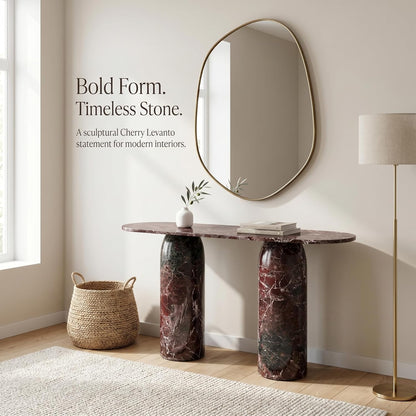 Marble console table with oval mirror and decorative items in a room setting.