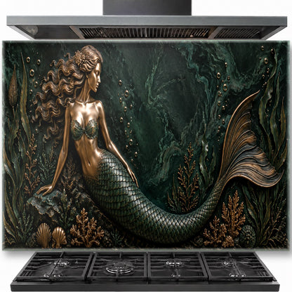 Mermaid tempered glass backsplash installed behind a modern gas stove in a coastal-style kitchen.