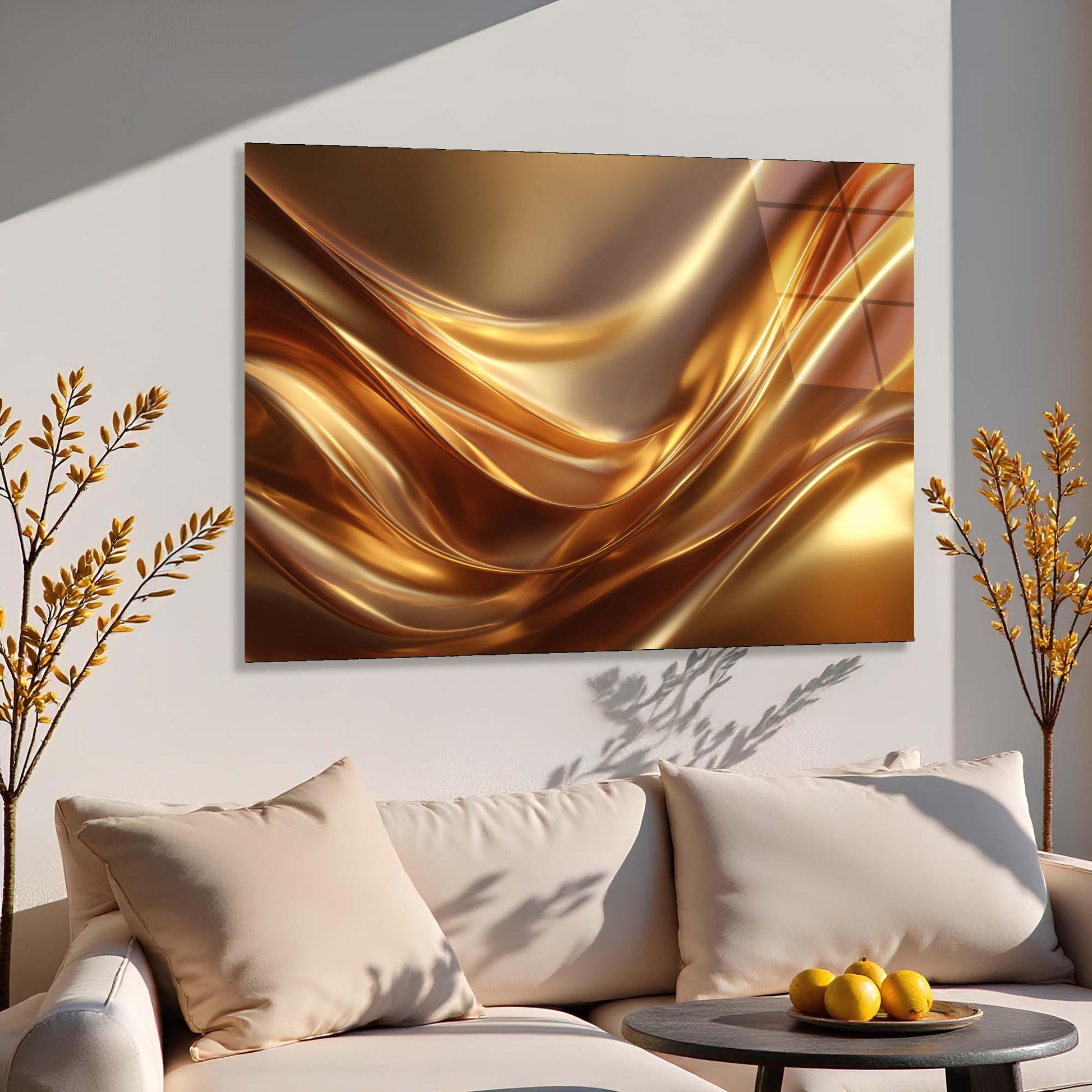 Abstract gold painting on a wall above a beige sofa with decorative elements.