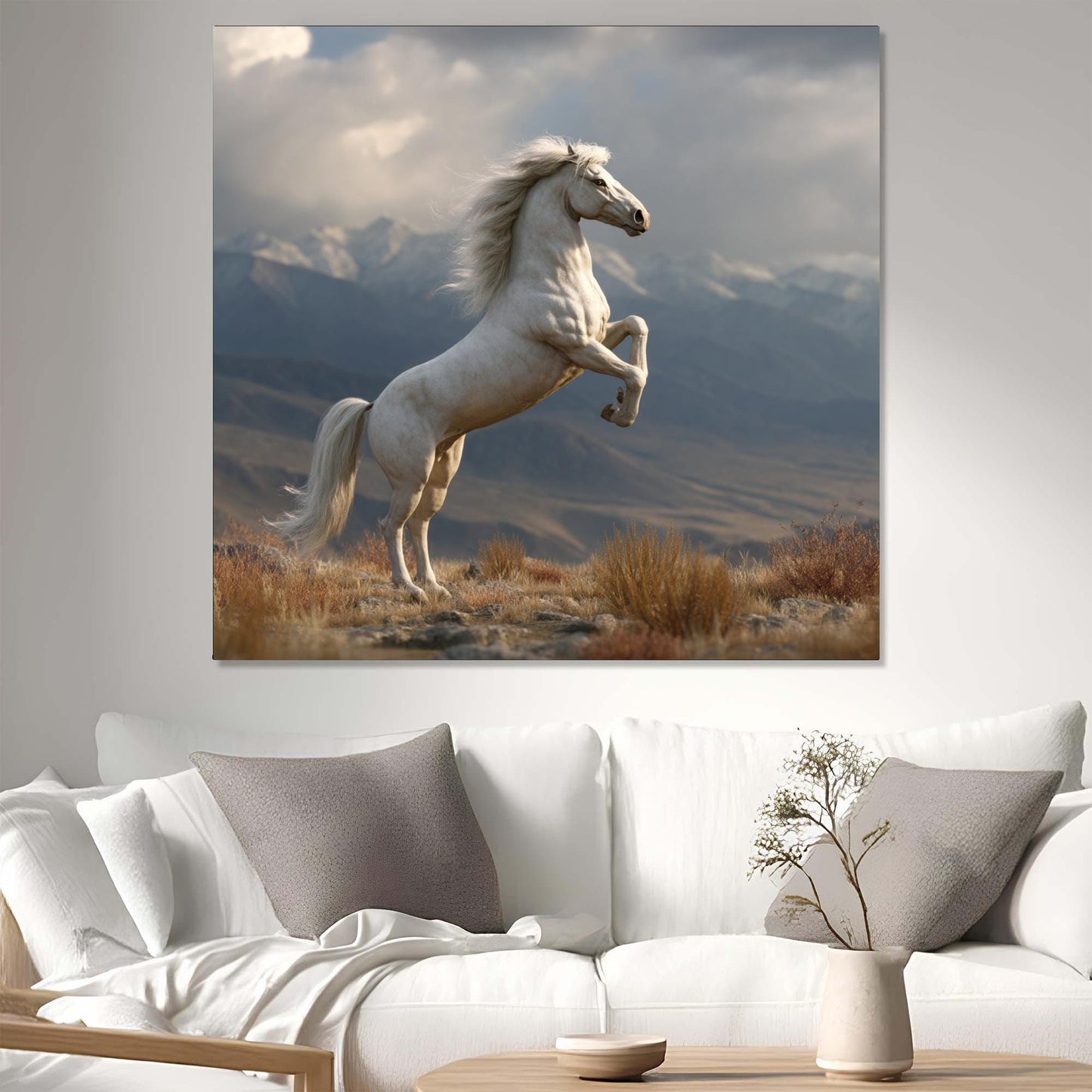 White horse painting on a wall above a white sofa with decorative pillows.